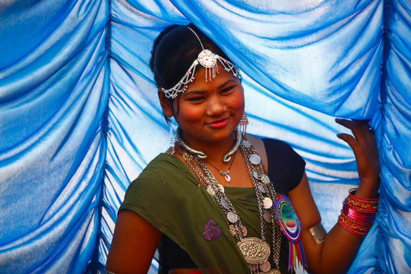 A Tharu girl dressed in traditional wear attends the Maghi Sankranti Festival celebrations in Kathmandu on Friday. It is celebrated by the Tharu community to mark the New Year.