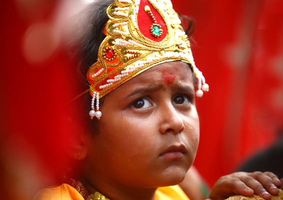A boy dressed up as Lord Krishna on the occasion of Krishna Janmashtami at Patan Darbar Square on Monday. On this day devotees visit the Krishna temple to celebrate the birth of the Hindu deity.