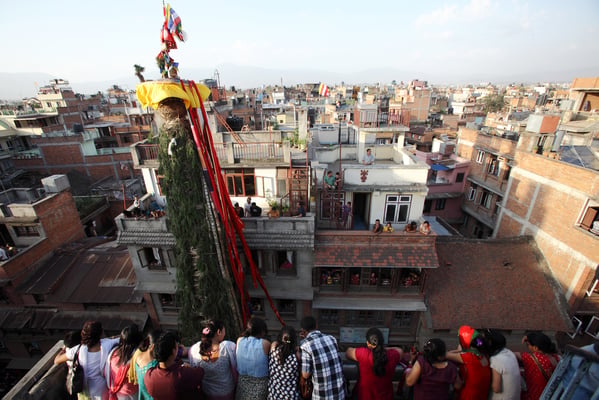 UP HERE: Locals of Mangal Bajar watch the Rato Machhindranath procession on Monday afternoon.