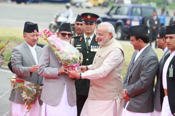 Prime Minister Sushil Koirala welcoming Indian Prime Minister Narendra Modi at the Tribhuvan International Airport on Sunday.