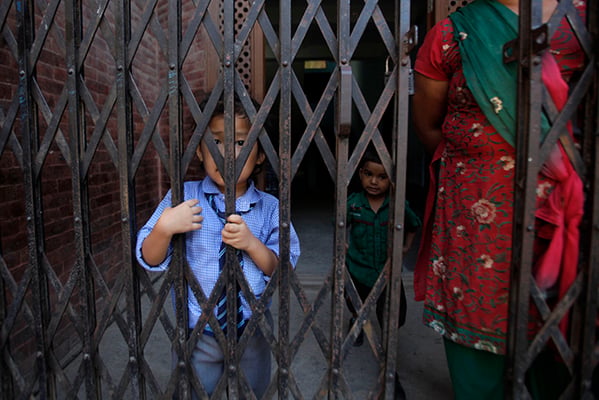 5-year-old Rashmi Pulami waits for a family member to pick her up from school after the 4.3 aftershock on Tuesday morning. Most schools were closed following the aftershock, epicentred at Kalimati.