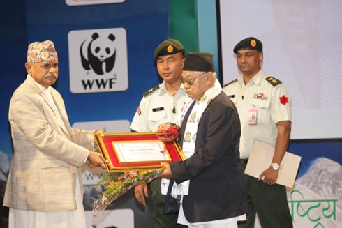 BIRDSONG: President Ram Baran Yadav presents the Bird Conservation Lifetime Achievement Award to Hari Sharan Nepali at Tripureswor on Monday.