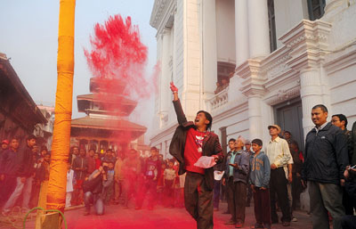 HOLI-DAY: Locals of Basantapur install a ceremonial poll, chir, on Wednesday to mark the beginning of Holi.