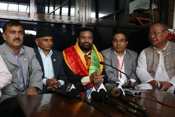 Deputy Prime Minister and Home Minister Bimalendra Nidhi talks to journalists at Kathmandu Airport before leaving for New Delhi on Thursday.