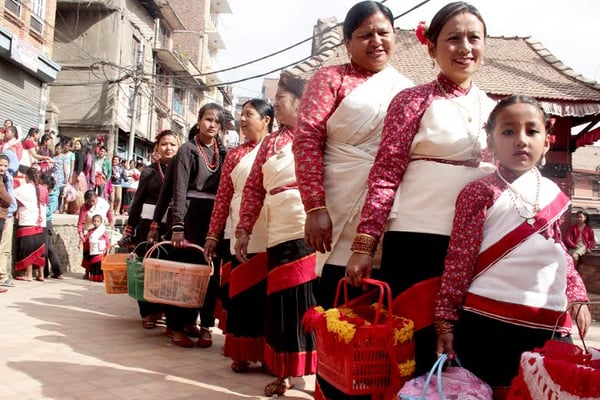 QUEUE UP: Women dressed in traditional Newari attire for Bhimsen Puja at Chyasal.