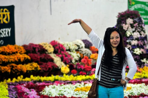 SAY CHEESE: A visitor poses for a picture at the the 2nd International Flora Expo at Bhrikuti Mandap, Kathmandu on Thursday