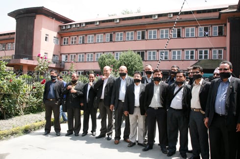 ORDER ORDER: Members of the Nepal Bar Association stand outside the Supreme Court with black ribbons on their mouths to protest CIAA's raid on their office, on Sunday.
