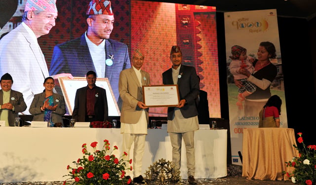 Vice Chairperson of National Planning Commission Yubaraj Khatiwada, hands over certificate of accreditation to Paras Khadka as Goodwill Ambassador for Nutrition, Food Security and Golden 1,000 Days Awareness Campaign at Hyatt Regency, Boudha on Thursday.