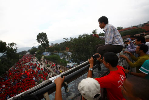 SEA OF RED: People taking pictures of the rally organised by Young Communist League near Sundhara on Saturday.