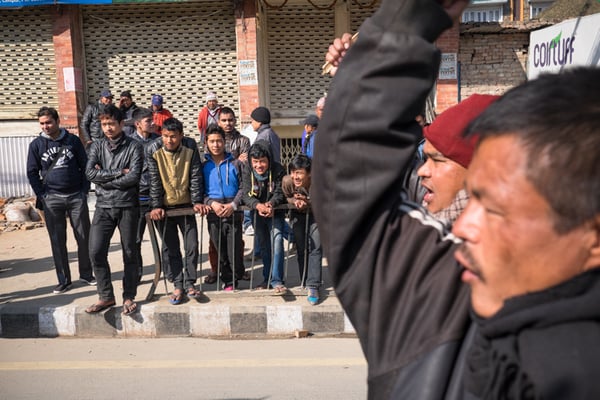 Locals looking on from the side of the road during a protest held on Tuesday by members of the Federal Socialist Party Nepal (FSPN).