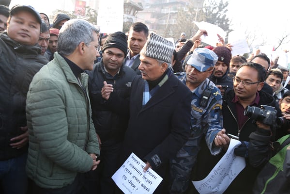 Bibeksheel Sajha leader Rabindra Mishra (left) and Naya Shakti Coordinator Baburam Bhattarai join the protest organised by supporters of crusader Govinda KC at Maitighar mandala on Tuesday.