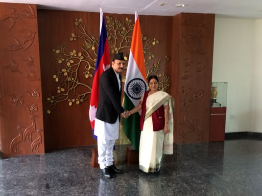 Minister of Foreign Affairs Prakash Sharan Mahat shakes hands with his Indian counterpart Sushma Swaraj in New Delhi on Monday.