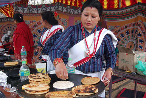 LET'S EAT: Women from Newar community make traditional breads called bara during the Trade Fair in Bhrikuti Mandap, Kathmandu.