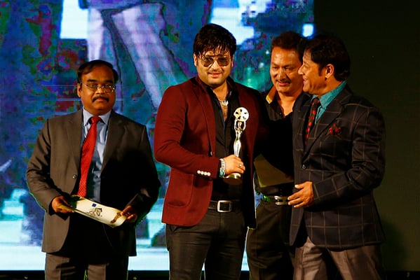 Aryan Sigdel receiving the best male actor award during National Film Award 2071 at Hotel Hyatt Regency on Saturday.