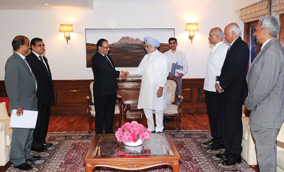 LONG TIME NO SEE: Chairman of UCPN (M) Pushpa Kamal Dahal greets Indian Prime Minister Manmohan Singh at the PM’s Office in New Delhi on Tuesday.