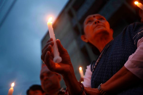 JUSTICE FOR ALL: Anuradha Koirala of Maiti Nepal during the candlelight vigil organised in support of Ganga Maya and Nanda Prasad Adhikari at Bir Hospital on Monday. The Adhikari couple are on a hunger strike demanding investigation into their son's case who was allegedly killed by the Maoists in 2004.
