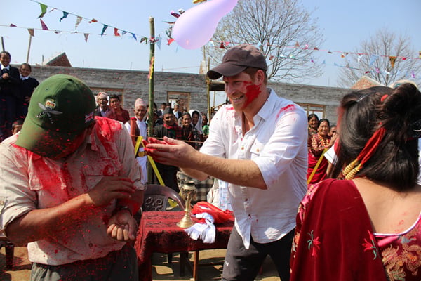Britain's Prince Harry celebrates Holi with students of Gaunda Secondary School in Lamjung on Tuesday.