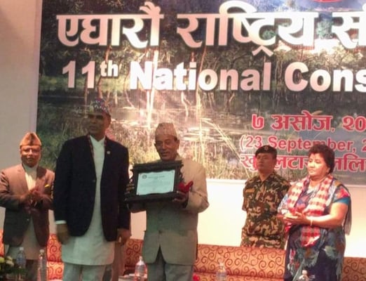 Former national park warden Ram Prit Yadav being conferred this year's Conservation Award on Saturday on National Conservation Day that commemorates the tragic helicopter crash on 23 September that killed Nepal's top environmentalists in 2006.