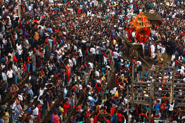 People gather around Basantapur Darbar Square to observe chariot procession of living goddess Kumari on the occasion of Indra Jatra on Tuesday. The eight-day festival celebrates Indra, the king of gods and rain.