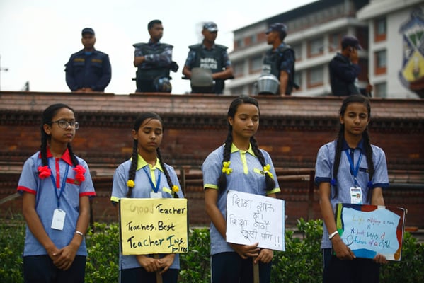 Students attend a rally on the occasion of International Literacy Day and National Education Day at Maitighar on Tuesday.