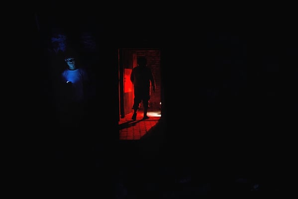 People using their torchlight and light from their mobile phones to move around on Saturday night during load-shedding hours.