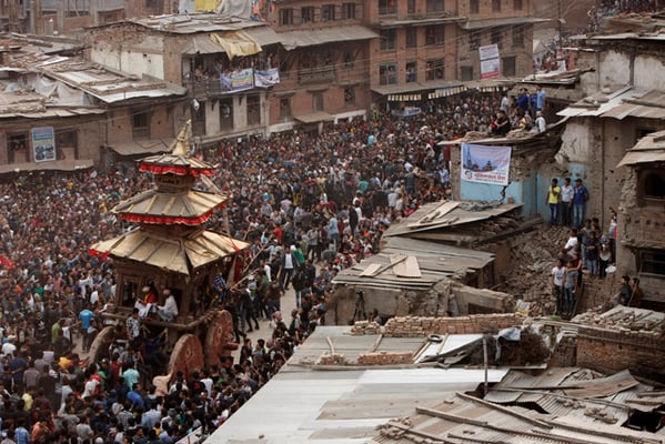 Locals pull the chariot of Bhairab during Bisket Jatra as onlookers watch from their damaged homes in Bhaktapur on Wednesday.
