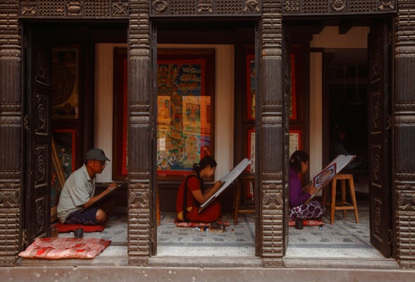 Artists working on thanka art in Bhaktapur on Monday. Thankas are known to have evolved from paubha painting, a style unique to the Valley and now considered a dying tradition.