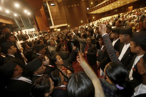 Opposition lawmakers shout slogans to disrupt the CA meeting on Tuesday