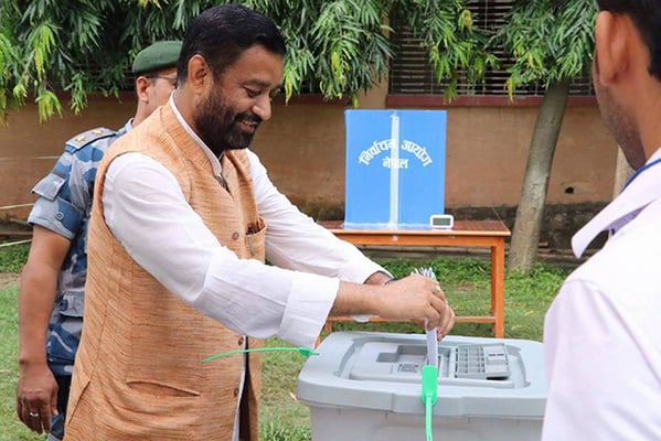 Nepali Congress leader Bimalendra Nidhi casts his vote during the Province 2 polls in Dhanusa on Monday.