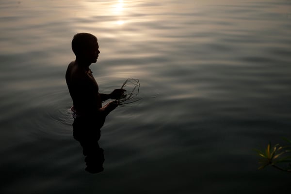 A man performs morning rituals at Ganga Sagar in Janakpur on Wednesday.