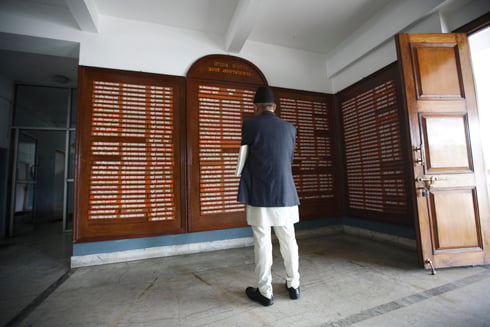 WHO'S WHO: A man goes through the list of employees at the Ministry of Finance in Singha Darbar.