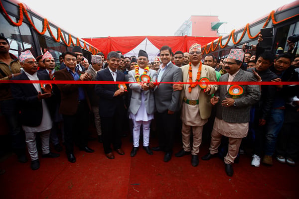 Minister for Industry Som Prasad Pandey with comedy actors Madan Krishna Shrestha and Hari Bansha Acharya at the opening ceremony of Mahanagar Yatayat Pvt.Ltd at Banasthali on Sunday.