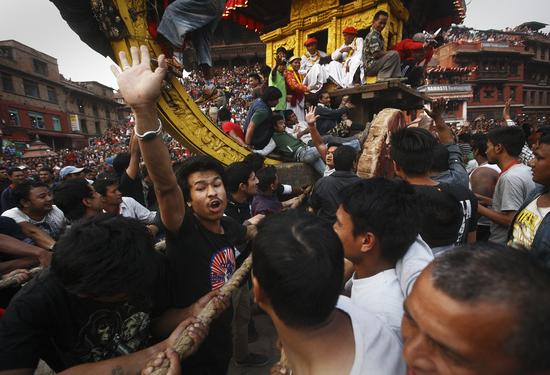 The chariot of Bhairab is pulled through the city centre of Bhaktapur during the Bisket Festival on Friday.