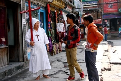 IN THE NAME OF THE FATHER: A Japanese walks around evangelising in Thamel on Tuesday afternoon.