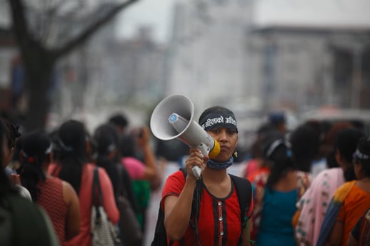An activist shouts slogans demanding citizenship through mother's name during a rally in Kathmandu on Tuesday.