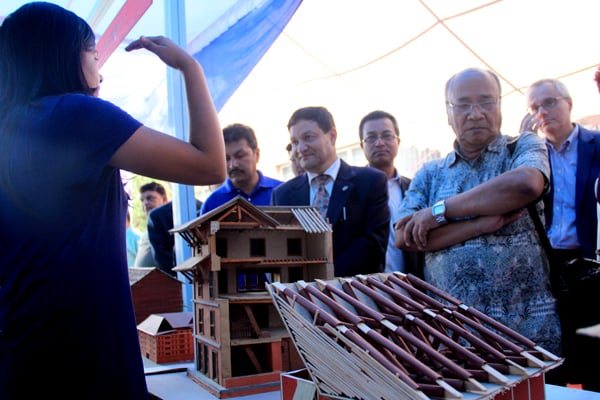 People observe earthquake resistant housing models in a three-day exhibition that began in Kathmandu on Thursday.