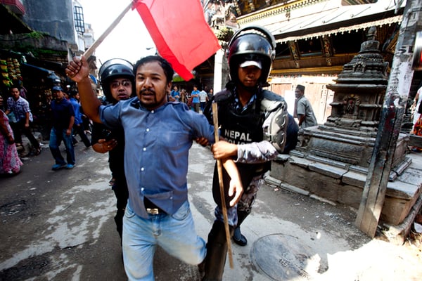Police detain a protester during a nationwide strike called by opposition parties led by Biplav Maoist against the new constitution at Bhimsenthan on Sunday.