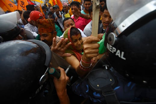 Hindu activists clash with the police at a protest rally demanding Nepal to be declared as a Hindu state in the new constitution in Baneswor on Monday.