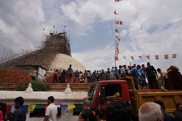 Volunteers help stack bricks next to the Stupa on the occasion of Buddha Jayanti at Boudha on Saturday.