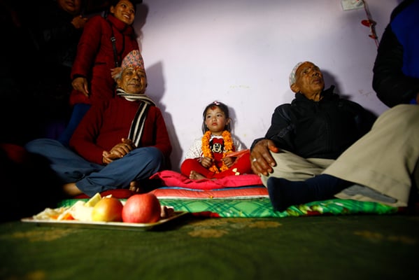 Five-year-old Nihira Bajracharya. newly appointed Kumari (Living Goddess) of Patan at the residence of the priest on Monday.