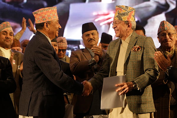 Rastriya Prajatantra Party-Nepal (RPP-N) Chairman Kamal Thapa and Rastriya Prajatantra Party (RPP) Chairman Pashupati Shamsher Rana shake hand after announcing the unification of their parties in Kathmandu on Monday.
