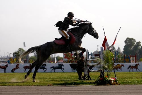 A Nepal Army cavalryman performs stunts during the Ghode Jatra festival at Khula Manch on Friday.