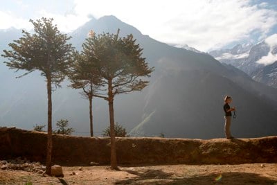 DOUBLE CHECK: A tourist reviews pictures she’s previously taken with her camera at Namche on Tuesday morning.