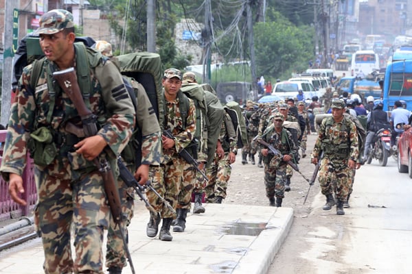 Nepal Army soldiers return to their barrack after a routine combat training in Kathmandu.