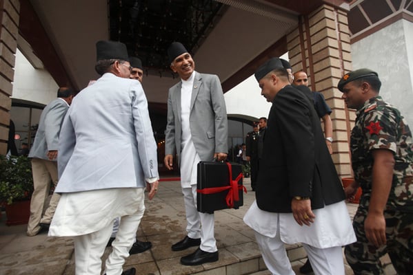 Finance Minister Bishnu Paudel before entering the Parliament to present the budget for fiscal year 2073/74 in Kathmandu on Saturday.