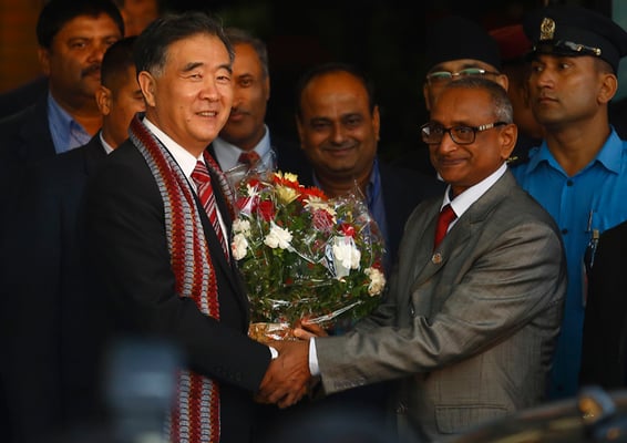 Minister of Culture Tourism and Civil Aviation Jitendra Narayan Dev greets Deputy Vice Premier of China Wang Yang at the Tribhuwan International Airport on Monday.