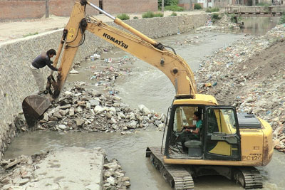 WATCH OUT: Construction workers dig up canal walls along the Dhobi Khola as part of the Bagmati corridor project.