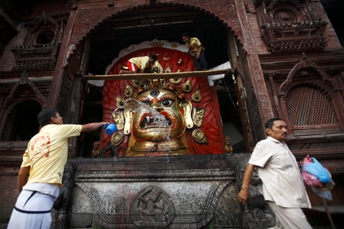 CELEBRATION TIME: People wash the idol of Swet Bhairav in Basantapur on Monday for Wednesday's Indra Jatra celebrations.