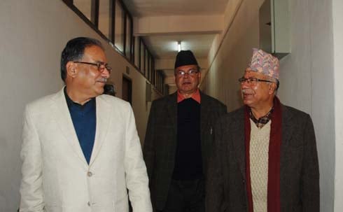 HAPPY FACES: UCPN (Maoist) Chiarman Pushpa Kamal Dahal (left) with UML leaders Jhalanath Khanal (center) and Madhav Kumar Nepal leave the meeting hall at Babarmahal after a three-party gathering on Tuesday.