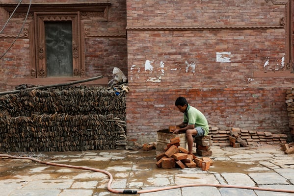 Dinesh Basnet, a construction worker prepares the bricks salvaged from the Swet Bhairav temple after the earthquake for its reconstruction at Kathmandu Darbar Square on Wednesday.